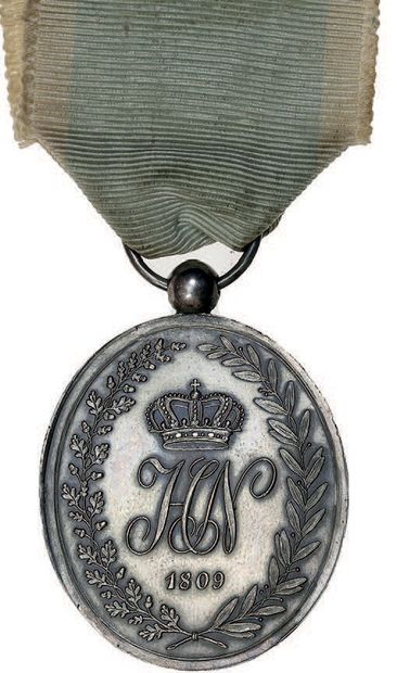 null 
1809



Military medal of Westphalia (1st type).



Silver. 37 x 32 mm. Clasp...