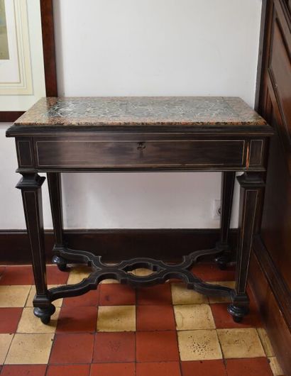 null Desk table in blackened wood veneer and clear net, opening to a drawer. Feet...