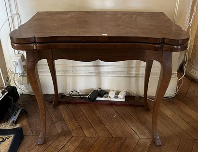 null Game table with folding top, inlaid top, cambered legs.

Louis XV style.

Height...