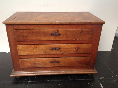 null Walnut chest of drawers opening to three drawers, parquet top, plinth feet.

Regional...