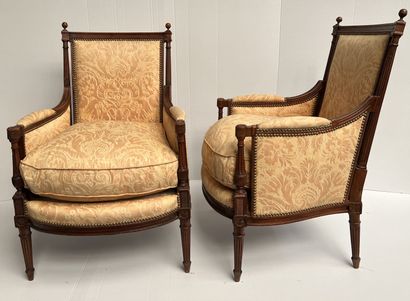 null Pair of walnut bergères

Directoire style 

Uprights and armrests with detached...