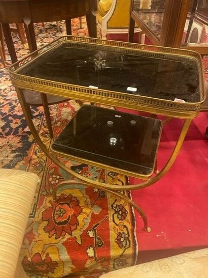 null Small side table with two black glass tops, brass frame.

Circa 1960.