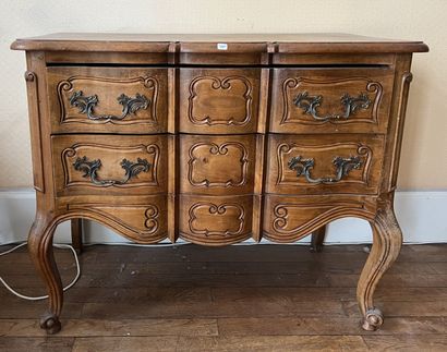 null Louis XV style chest of drawers with a crossbow profile front, opening with...