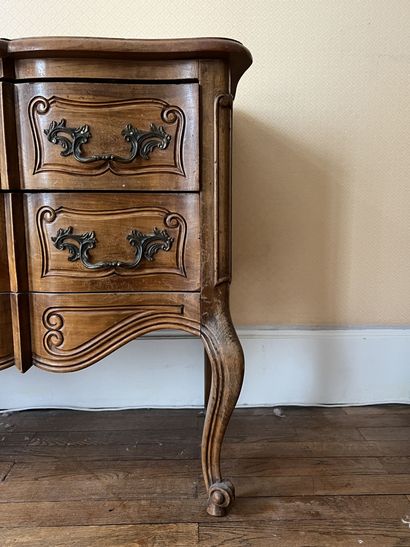 null Louis XV style chest of drawers with a crossbow profile front, opening with...