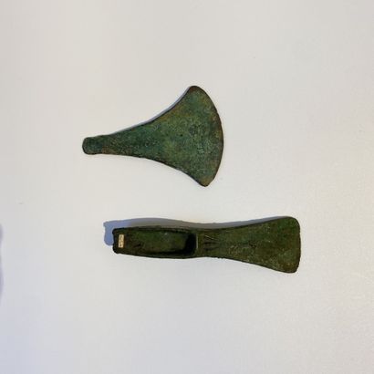 null LOT including a flat axe with a large fan-shaped blade; and a heel axe of the...