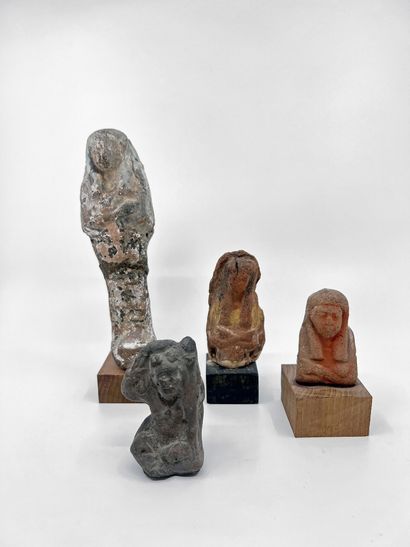 null LOT composed of three fragmentary oushebtis and a seated Harpocrates. Terracotta,...
