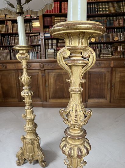 null Pair of large giltwood candlesticks carved with crosses and foliage, on a tripod...