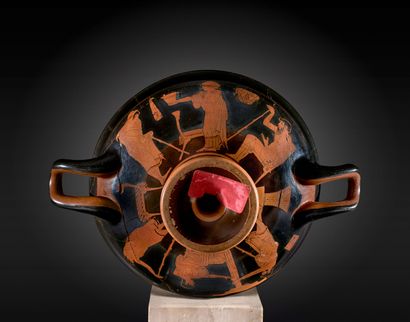 null KYLIX WITH RED FIGURES type "C" whose tondo is decorated inside a border lined...