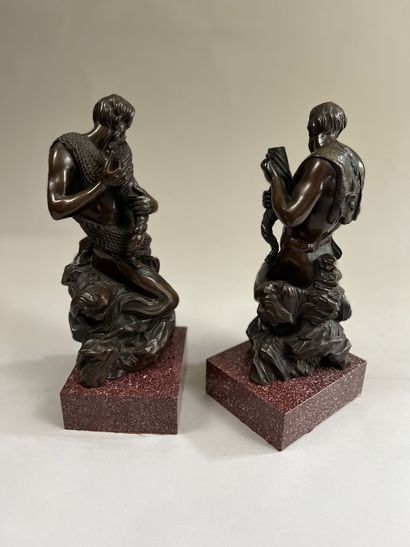 null TWO STATUETTES in patinated bronze : Fishing triton and hunting triton holding...
