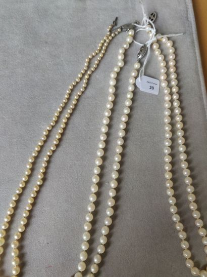 Three necklaces of cultured pearls in fall,...
