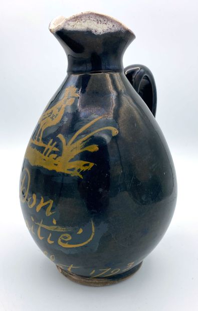 null Normandy, glazed earthenware cider pitcher, black background with yellow decoration...