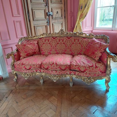 null ROOM FURNITURE in carved and gilded wood rocaille including A SOFA and A PAIR...