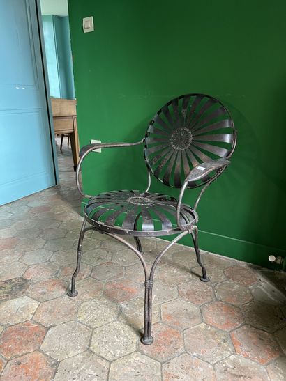 Oxidized steel laminated armchair with openwork...