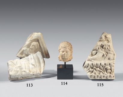 null Lot composed of two fragments of reliefs representing an acephalous bust of...
