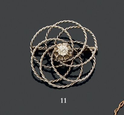 750 thousandth white gold brooch decorated...