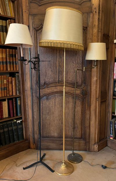 null REUNION OF THREE LAMPADAIRES and a READER in wrought iron and gilt brass.
With...