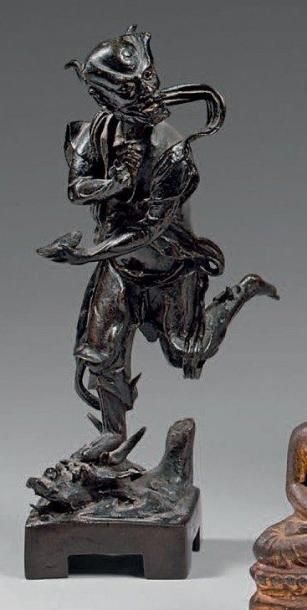 Statuette de Gui Xing en bronze à patine...