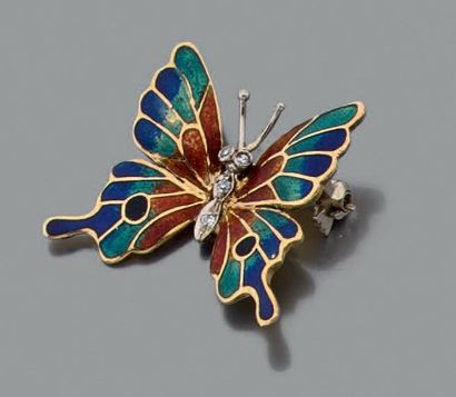 null Broche « papillon » en or émaillé en polychromie, le centre serti de quatre...