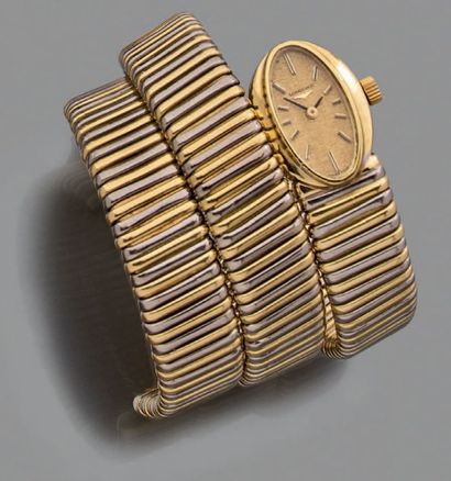 Longines, signé et numéroté 17395174 Montre-bracelet serpent en or jaune et gris...