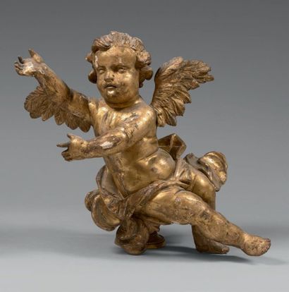 null Statuette d'angelot dans les nuées en bois doré.
Début du XVIIIe siècle.
Hauteur:...