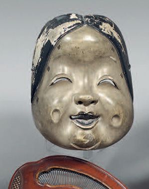 JAPON - Epoque MEIJI (1868-1912) Masque d'Okame souriante, en bois peint.
(Accidents...