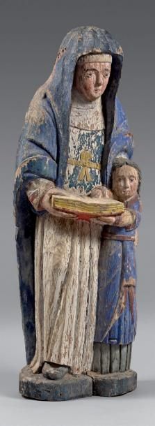 null Statue en chêne polychrome représentant une Sainte Anne apprenant à lire à la...