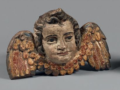 null Tête d'angelot en bois résineux polychrome.
XVIIIe siècle.
(Accident).
Hauteur:...