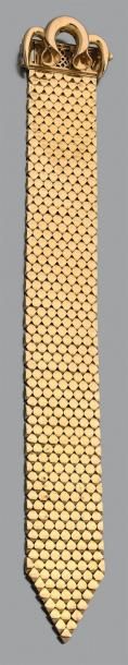 null Bracelet «ceinture» large et articulé en or jaune 750 millièmes à motifs géométriques.
Poids:...