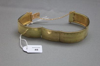 null Bracelet articulé en or jaune 750 millièmes, les maillons gravés à décor de...