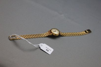 TISSOT Montre-bracelet de dame en or jaune 750 millièmes, la montre de forme ronde,...