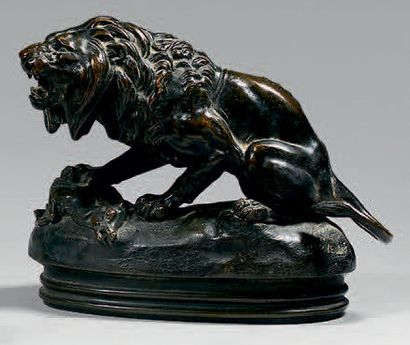 D'après Alfred BARYE 
Lion ayant attrapé une gazelle Statuette en bronze à patine...