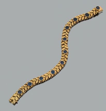 null Bracelet articulé en or jaune 750 millièmes tressé et partiellement gravé serti...