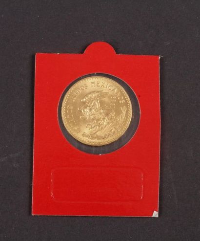 null Lot de 2 pièces en or étrangères :
- 20 Pesos en or. 1959
- 10 Gulden en or....