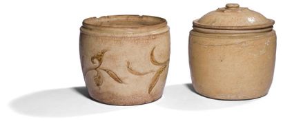 null VietnamTwo
jars, one covered in beige sandstone, one with incised
foliage
decoration
.

Ly-Tran...