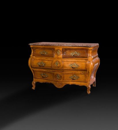 null Moulded and carved walnut chest of drawers, the lively front opening with four...