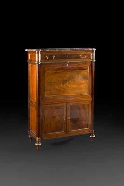 null Moulded mahogany secretary with a flap with brass rods, opening with one drawer...