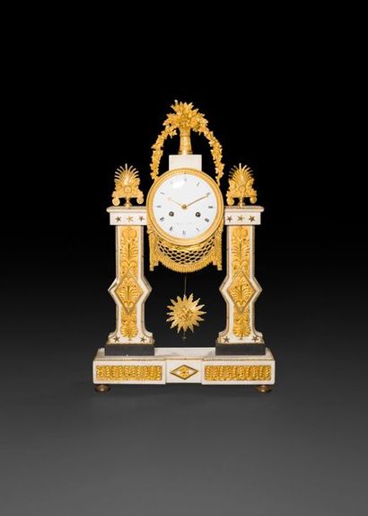 null White marble and gilt bronze clock in a portico shape, the dial with Roman numerals...