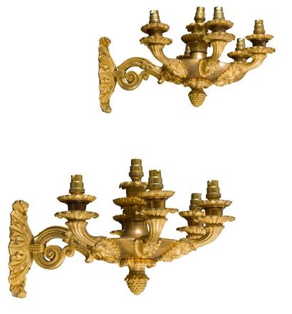 null Pair of gilt bronze sconces in circular form, five lights and foliage decoration,...