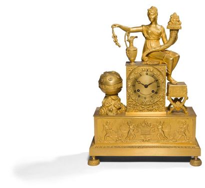 null Gilt bronze clock decorated with a woman draped in Antique style holding a horn...