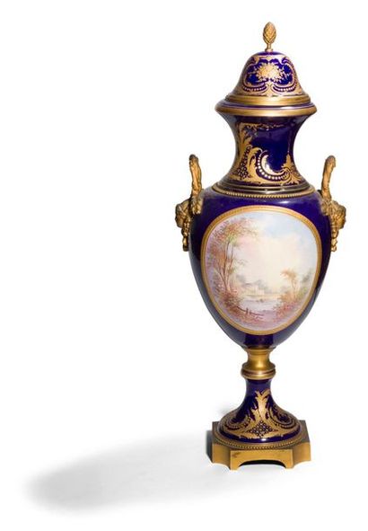 null Large polychrome and gold porcelain vase with a landscape decoration (signed...