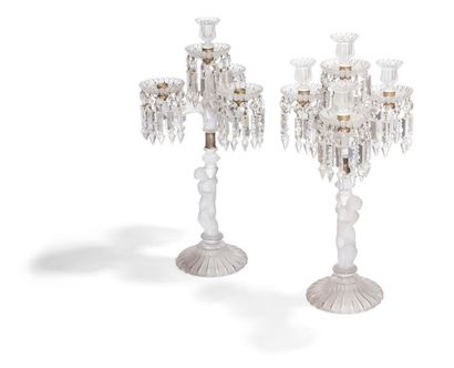 null Pair of Baccarat glass candelabra, with three arms of light, the shaft showing...