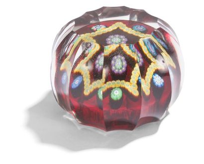 null Perthshire 
Paperweight with a translucent red background with a pattern of...