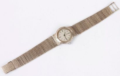 null OMEGA. Vers 1970
Montre bracelet pour femme en or gris 14K (585), cadran signé...