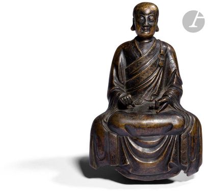 null CHINE - Époque MING (1368 - 1644)
Statuette en bronze à patine brune de moine...