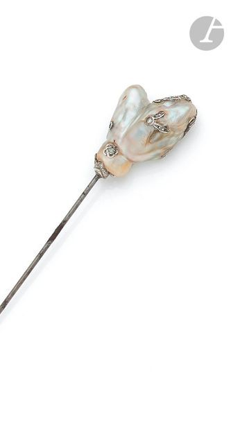 Metal hat pin topped with a pearl breath...