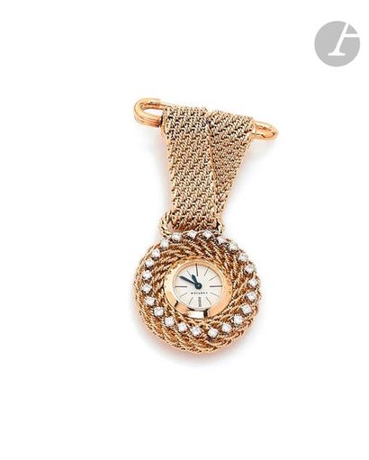 null CARTIER. Circa 1950150441 -
01523618K (750) yellow gold
watch
with its brooch...