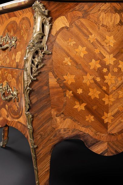 null Chest of drawers in marquetry of flowers of very animated form, the front opening...