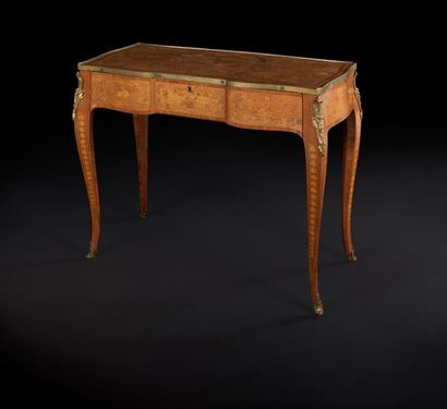 null Writing table in flower marquetry, opening to a drawer with a sliding top, revealing...
