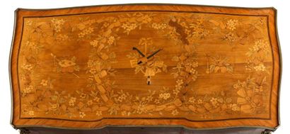 null Writing table in flower marquetry, opening to a drawer with a sliding top, revealing...