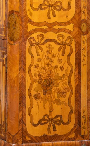 null Secretary with a flap in flower marquetry with an eventful shape on the front...